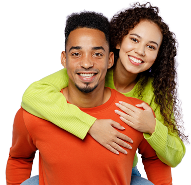 acp-law-testimonial Two people embracing, one in a lime sweater and the other in an orange shirt.