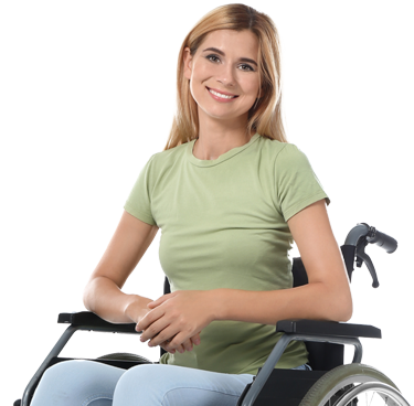 Person in a wheelchair wearing a green t-shirt and jeans.