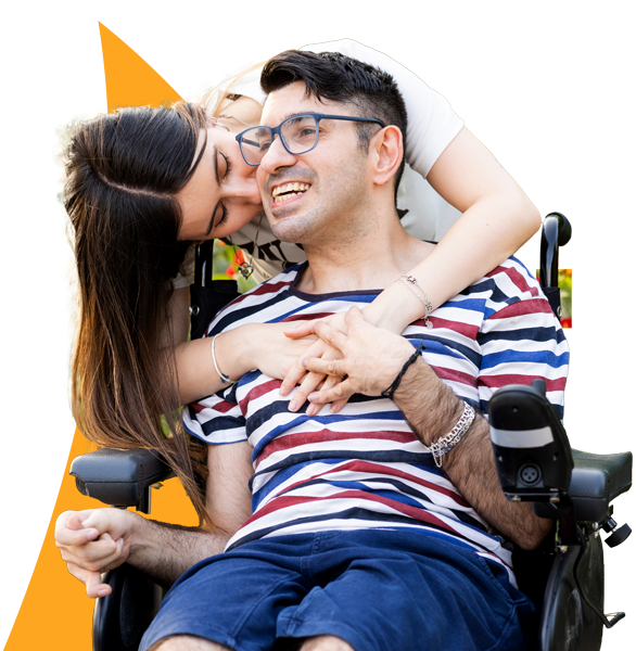 Person in a wheelchair embracing someone, with geometric shapes in the background. 