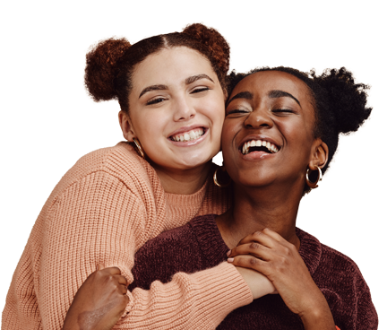 ACP-PNG-People-6 Two individuals embracing, one in a pink sweater and the other in burgundy, on a black background.