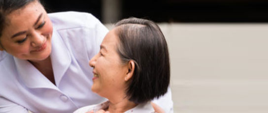 Narrow-Block-4 Person in a white shirt embracing a child with short hair.
